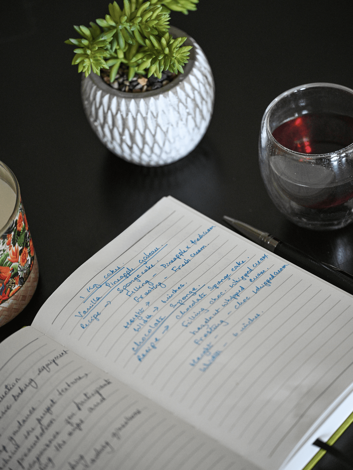A shot of my tea cup beside my recipe notebook.